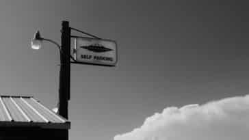 grayscale photo of stop sign